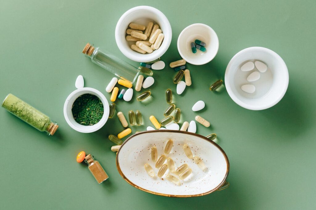 The Entrepreneur’s Guide to Turning Ideas Into Profitable Top view of various herbal and pharmaceutical supplements in ceramic bowls on a green background.
